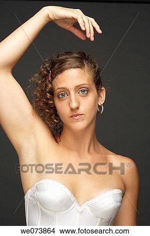 Girl on a white corset striking a pose View Large Photo Image Picture - Girl on a white corset striking a pose. Fotosearch