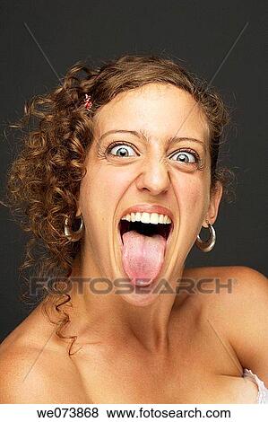 Girl sticking her tongue out View Large Photo Image Stock Photo - Girl sticking her tongue out. Fotosearch