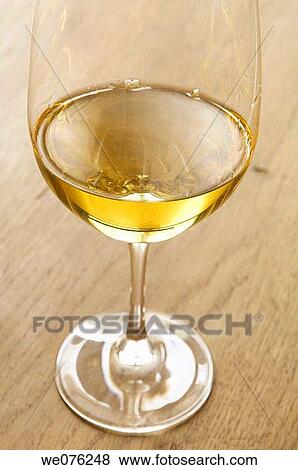 Glass of white wine View Large Photo Image Stock Photo - Glass of white wine. Fotosearch