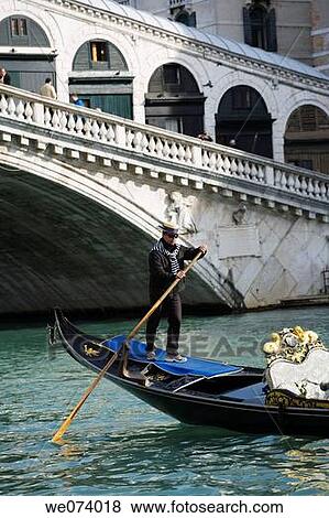 Stock Photo - Gondoliers and gondolas on the Grand Canal, Venice, Italy. Fotosearch