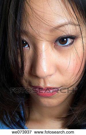Hair partially hides the eyes of this sexy young (20? s) Chinese Asian woman in this studio made facial close up. View Large Photo Image Stock Photo - Hair partially hides the eyes of this sexy young (20? s) Chinese Asian woman in this studio made facial close up.. Fotosearch