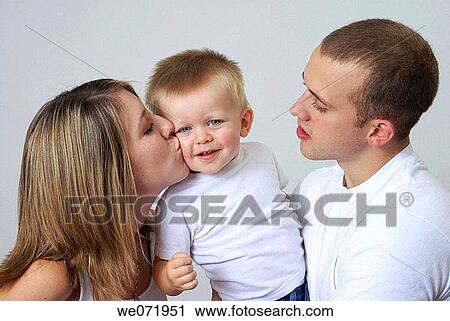 Happy young family with smiling little boy. View Large Photo Image Stock Image - Happy young family with smiling little boy.. Fotosearch