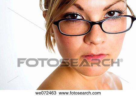 Head and shoulders portrait of young blond woman wearing glasses with hair pulled back. View Large Photo Image Stock Image - Head and shoulders portrait of young blond woman wearing glasses with hair pulled back.. Fotosearch