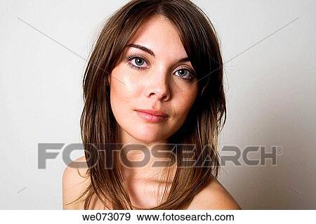 Head and shoulders studio portrait of cute early 20's brunette caucasian woman. View Large Photo Image Stock Photo - Head and shoulders studio portrait of cute early 20's brunette caucasian woman.. Fotosearch
