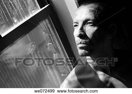 Hispanic man posing by his window. View Large Photo Image Stock Photo - Hispanic man posing by his window.. Fotosearch