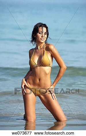Stock Photo - Latin girl posing on the beach. Fotosearch