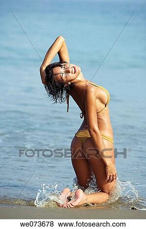 Latin girl posing on the beach View Large Photo Image Stock Photo - Latin girl posing on the beach. Fotosearch