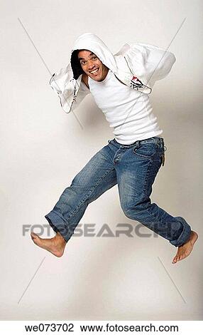 Latin man jumps View Large Photo Image Stock Image - Latin man jumps. Fotosearch