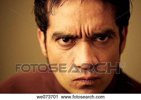 Latin man looking angry at the camera View Large Photo Image Stock Image - Latin man looking angry at the camera. Fotosearch