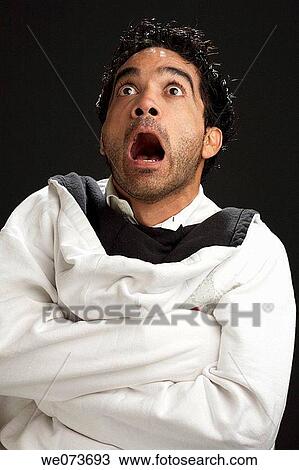 Latin man looking scared View Large Photo Image Stock Image - Latin man looking scared. Fotosearch