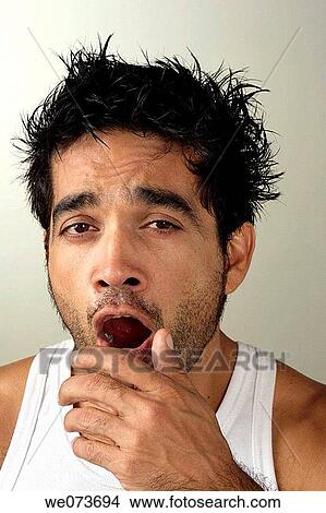 Latin man yawning View Large Photo Image Picture - Latin man yawning. Fotosearch