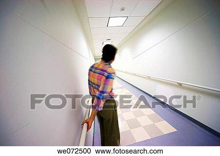 Man in the hallway of an office building. View Large Photo Image Stock Image - Man in the hallway of an office building.. Fotosearch