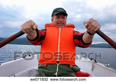 Man rowing a boat over Gaviksfj? rden, Norastr÷m, V? sternorrlands l? n, Sweden, Scandinavia, Europe View Large Photo Image Stock Image - Man rowing a boat over Gaviksfj? rden, Norastr÷m, V? sternorrlands l? n, Sweden, Scandinavia, Europe. Fotosearch