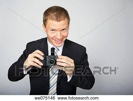 man taking photos View Large Photo Image Stock Photograph - man taking photos. Fotosearch