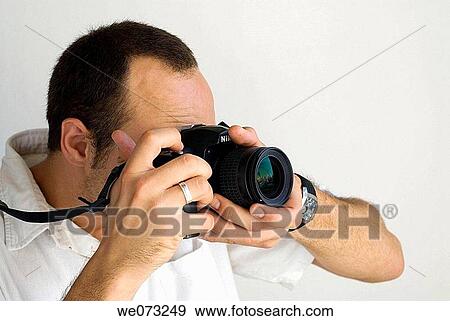 Man taking pictures View Large Photo Image Stock Photo - Man taking pictures. Fotosearch