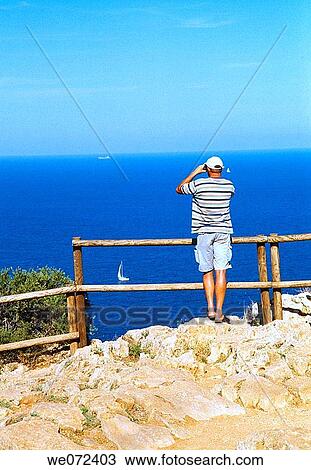 Man with binoculars at viewpoint, Cabo de la Nao. Alicante province, Comunidad Valenciana, Spain View Large Photo Image Stock Image - Man with binoculars at viewpoint, Cabo de la Nao. Alicante province, Comunidad Valenciana, Spain. Fotosearch