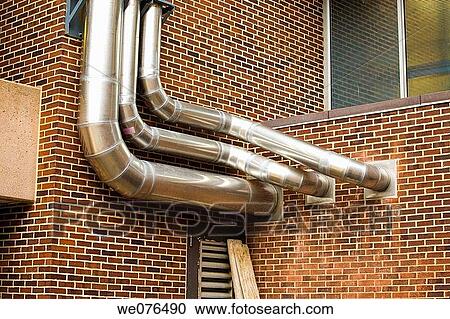 Metal pipes attached to the outside of a building. View Large Photo Image Stock Image - Metal pipes attached to the outside of a building.. Fotosearch
