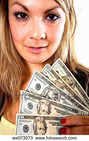 Mid 20's blond female shows off USD$100 in $20's in close up studio portrait. View Large Photo Image Stock Image - Mid 20's blond female shows off USD$100 in $20's in close up studio portrait.. Fotosearch