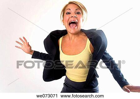 Mid 20's caucasian female makes crazy face while wearing business attire in studio portrait. View Large Photo Image Stock Image - Mid 20's caucasian female makes crazy face while wearing business attire in studio portrait.. Fotosearch