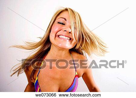 Mid 20's caucasian woman makes crazy happy face in studio portrait. View Large Photo Image Stock Photograph - Mid 20's caucasian woman makes crazy happy face in studio portrait.. Fotosearch