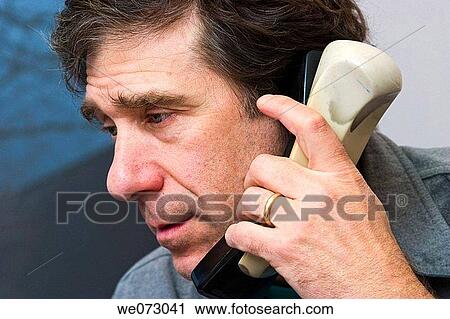 Middle-age man in his office talking on the telephone. View Large Photo Image Stock Image - Middle-age man in his office talking on the telephone.. Fotosearch