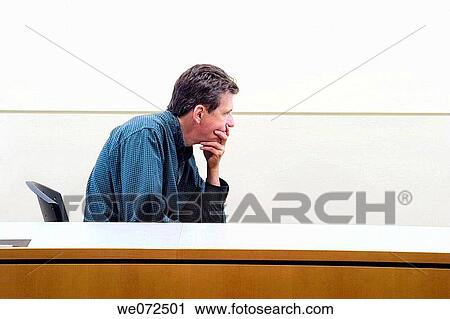 Middle_aged man sitting in a chair. View Large Photo Image Stock Image - Middle_aged man sitting in a chair.. Fotosearch