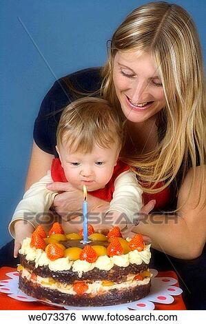 Mother and baby boy with first birthday cake View Large Photo Image Stock Photograph - Mother and baby boy with first birthday cake. Fotosearch