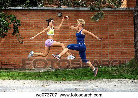 Mother and daughter exercise outdoors View Large Photo Image Stock Photo - Mother and daughter exercise outdoors. Fotosearch