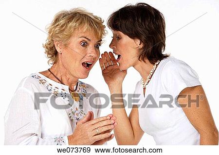 Mother and daughter gossip in a studio setting View Large Photo Image Stock Photo - Mother and daughter gossip in a studio setting. Fotosearch