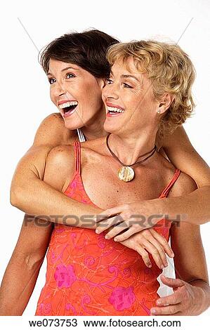 Mother and daughter hug in a studio setting View Large Photo Image Stock Image - Mother and daughter hug in a studio setting. Fotosearch