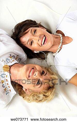 Mother and daughter listen to music in a studio setting View Large Photo Image Stock Image - Mother and daughter listen to music in a studio setting. Fotosearch