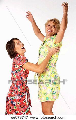 Mother and daughter play in a studio setting View Large Photo Image Stock Photo - Mother and daughter play in a studio setting. Fotosearch