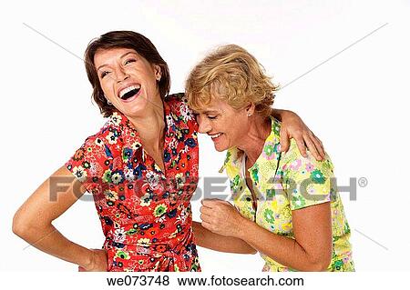 Mother and daughter share a laugh in a studio setting View Large Photo Image Stock Photo - Mother and daughter share a laugh in a studio setting. Fotosearch