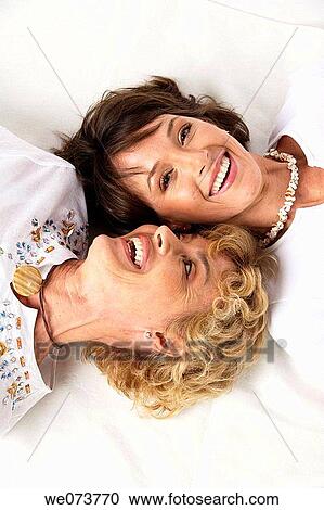 Mother and daughter talk in a studio setting View Large Photo Image Stock Image - Mother and daughter talk in a studio setting. Fotosearch