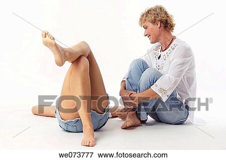 Mother and daughter talk in a studio setting View Large Photo Image Stock Photo - Mother and daughter talk in a studio setting. Fotosearch