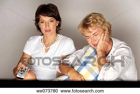 Mother and daughter watching television View Large Photo Image Stock Image - Mother and daughter watching television. Fotosearch