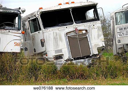 Old 18 wheeler tractor in a salvage yard View Large Photo Image Stock Photo - Old 18 wheeler tractor in a salvage yard. Fotosearch