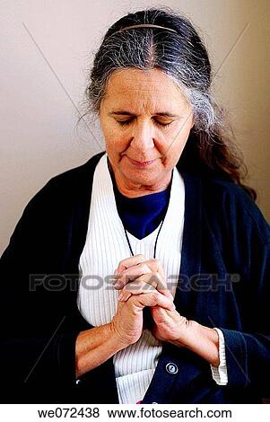 Stock Photo - Older Woman Praying. Fotosearch