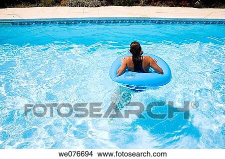 Picture - Playing in a pool in the Provence of France. Fotosearch