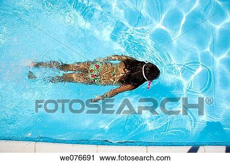 Playing in a pool in the Provence of France View Large Photo Image Stock Image - Playing in a pool in the Provence of France. Fotosearch