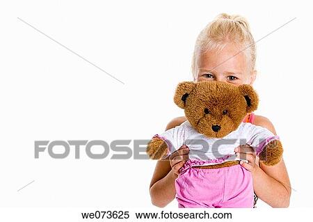 Portrait of a blond girl with her toy bear View Large Photo Image Stock Photography - Portrait of a blond girl with her toy bear. Fotosearch