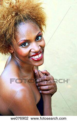 Portrait of woman with hands on heart View Large Photo Image Stock Image - Portrait of woman with hands on heart. Fotosearch