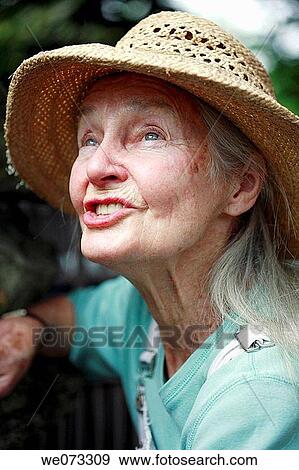 Senior woman with straw hat with crazy expression View Large Photo Image Stock Photo - Senior woman with straw hat with crazy expression. Fotosearch