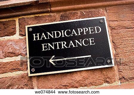Sign with an arrow reading? Handicapped entrance? View Large Photo Image Picture - Sign with an arrow reading? Handicapped entrance?. Fotosearch