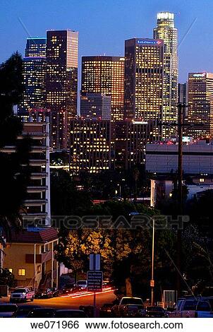Skyscrapers light up as the sun goes down in Los Angeles, California, USA at dusk, sunset, night View Large Photo Image Stock Photograph - Skyscrapers light up as the sun goes down in Los Angeles, California, USA at dusk, sunset, night. Fotosearch