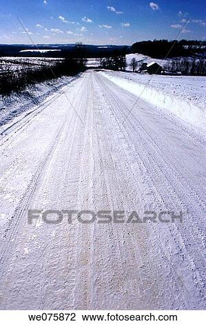 Stock Image - snow covered rural road. Fotosearch