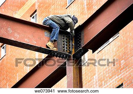 Steel constrcution worker fastening anchor bolts on steel frame View Large Photo Image Stock Image - Steel constrcution worker fastening anchor bolts on steel frame. Fotosearch
