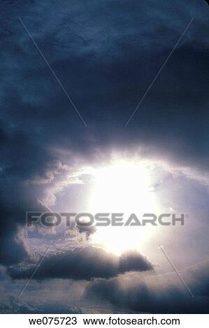 Stock Image - SUNBEAMS THROUGH. CLOUDS. Fotosearch