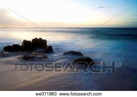 Surf, foam, rocks and the Pacific Ocean on the North Shore of Oahu, Hawaii, USA at dusk View Large Photo Image Stock Image - Surf, foam, rocks and the Pacific Ocean on the North Shore of Oahu, Hawaii, USA at dusk. Fotosearch