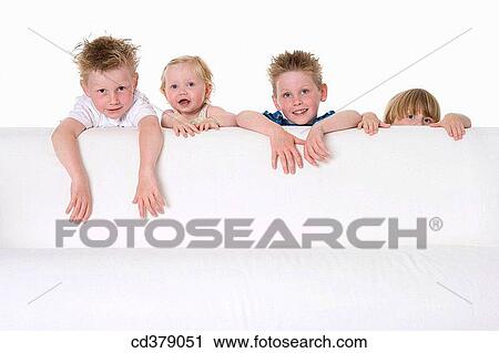 Three boys and a girl looking over a bench View Large Photo Image Stock Image - Three boys and a girl looking over a bench. Fotosearch